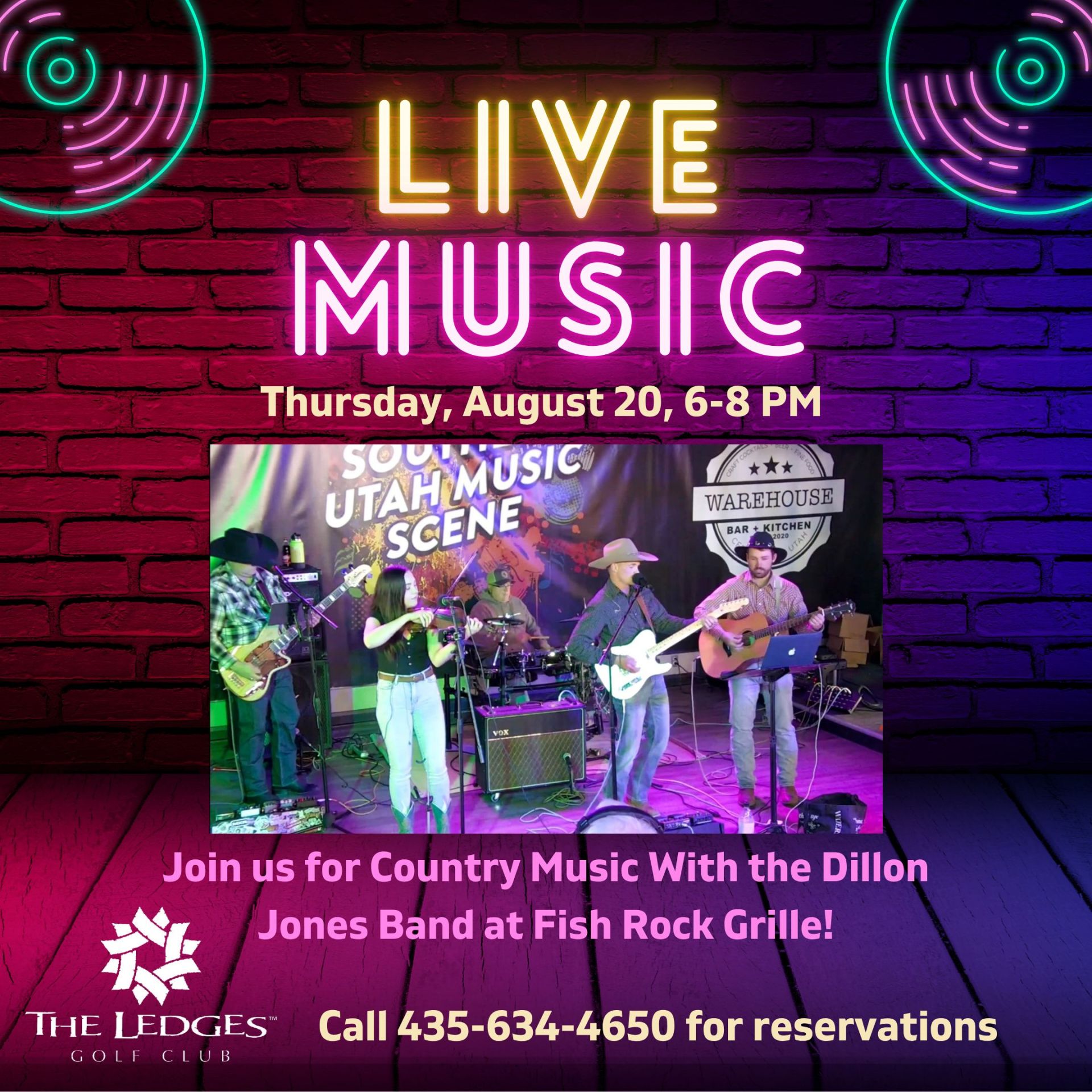 Neon sign saying 'LIVE MUSIC' on a brick wall with a band performing on stage below.